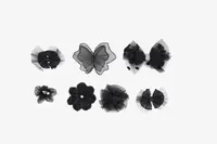 Seven black tulle and satin hair accessories, including bows and flowers, for PinkPantheress's "Unfinished Flats" project