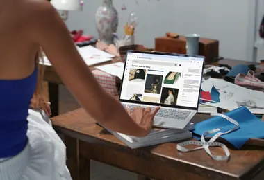 PinkPantheress designs custom ballet flats for Vicky on a laptop, surrounded by fabric and sketches