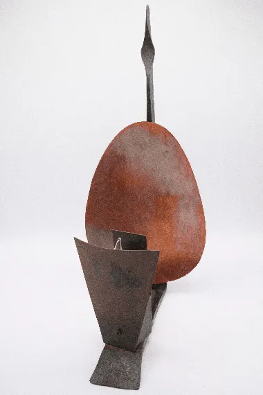 Solange Knowles's unfinished sculpture features a rust-colored oval and dark metal geometric shapes on a white background